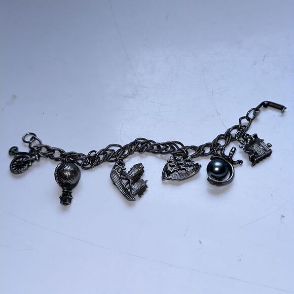 Vintage silver tone charm bracelet featuring modes of travel - Picture 5 of 8